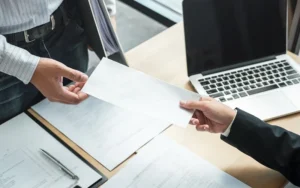 Businessman sending a resignation letter to employer boss in order to resign dismiss contract, changing and resigning from work concept