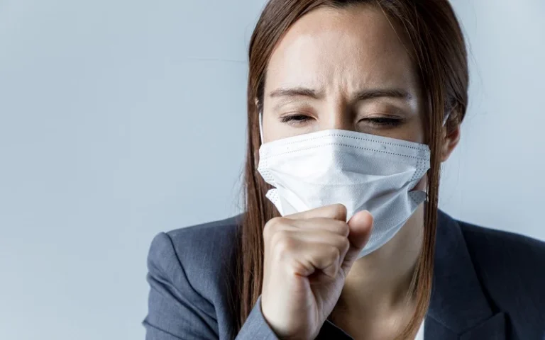young woman wearing a mask. catching a cold. health care concept.