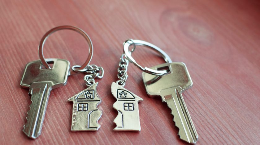 Two keys with split key rings with pendant in shape of house